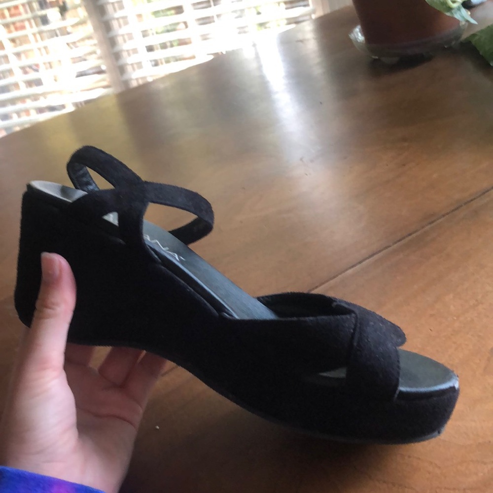 Black Suede platform shoes.